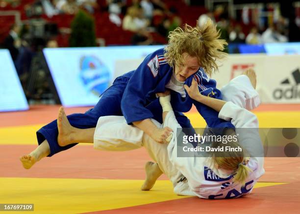 Lucie Louette of France throws Ana Velensek of Slovenia for ippon to win the u78kgs final during the Budapest European Championships at the Papp...