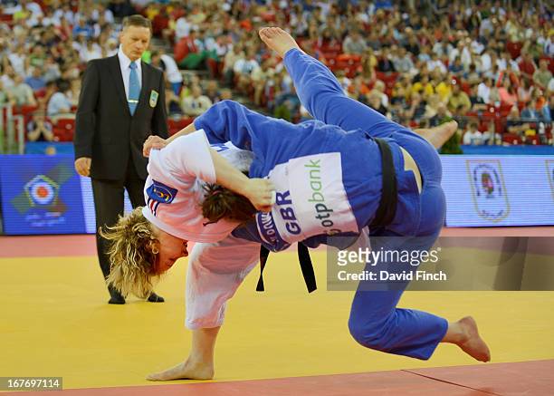 Lucie Louette of France throws Natalie Powell of Great Britain for ippon during their u78kgs contest during the Budapest European Championships at...