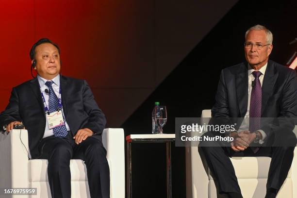 September 18, 2023 : Hou Qijun, Director anf President of China National Petroleum Corporation, and Darren Woods, the CEO of ExxonMobil, are seen...