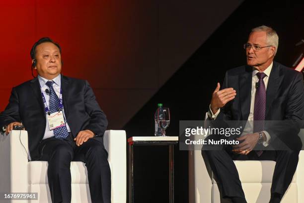 September 18, 2023 : Hou Qijun, Director anf President of China National Petroleum Corporation, and Darren Woods, the CEO of ExxonMobil, are seen...