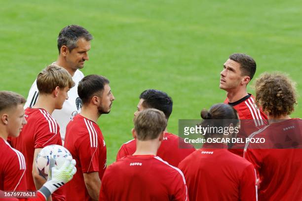 Union Berlin's German defender Robin Gosens and teammates attend a training session on the eve of the UEFA Champions League football match between...