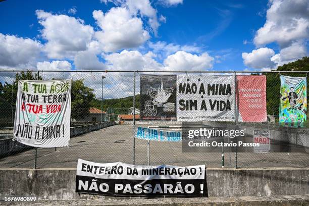 Posters with slogans against the construction of the lithium mine are seen in the center of the village on September 19, 2023 in Covas do Barroso,...