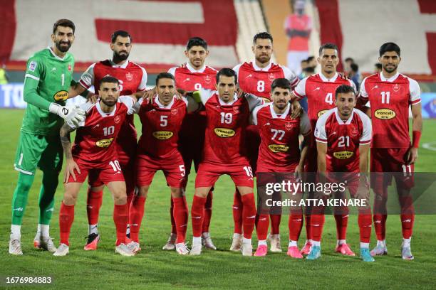 Persepolis team players pose for a group picture during the AFC Champions League group E football match between Persepolis FC and al-Nassr FC at...