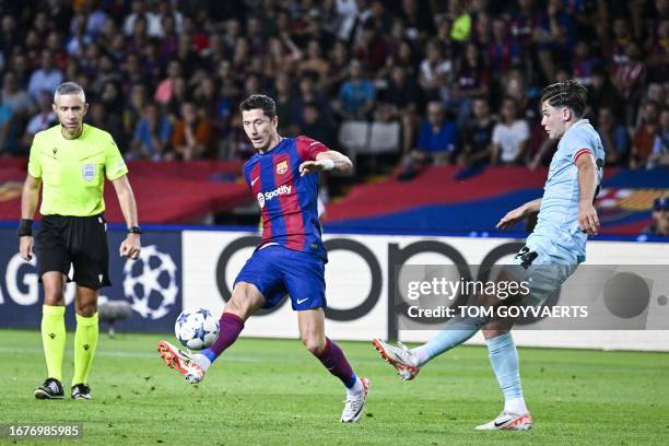 Barcelona's Robert Lewandowski and Antwerp's Jurgen Peter Ekkelenkamp pictured in action during a soccer game between Spanish FC Barcelona and...