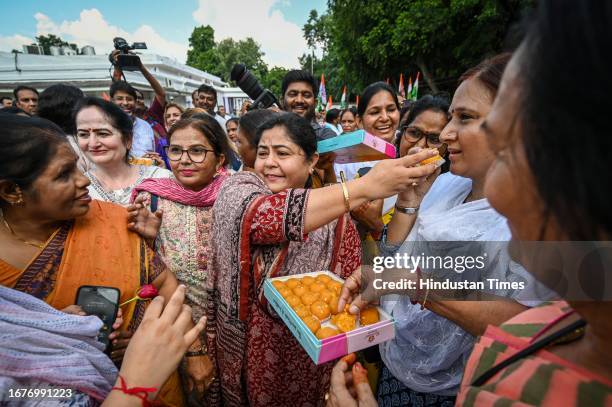 Congress leader Netta D'souza along with supporters celebrates to thank Congress leader Sonia Gandhi for her constant pursual on Women Reservation...