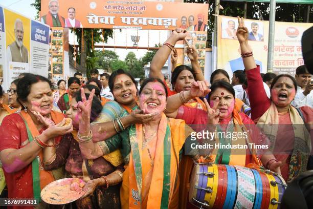 Mahila Morcha activists celebrating after the Women's reservation bill introduced in the Parliament at BJP office on September 19, 2023 in Patna,...