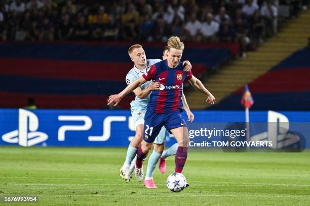 Antwerp's Arthur Vermeeren and Barcelona's Frenkie de Jong pictured in action during a soccer game between Spanish FC Barcelona and Belgian Royal...