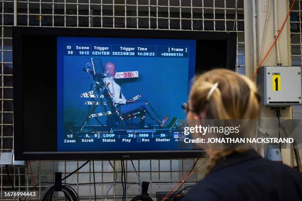 Astrid Linder, an engineer at the Swedish National Road and Transport Research Institute , watches a slow motion footage of the world's first female...