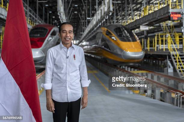 Joko Widodo, Indonesia's president, at Tegalluar station in front of Jakarta-Bandung High-Speed Railway trains in West Java, Indonesia, on Tuesday,...