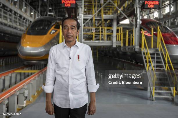 Joko Widodo, Indonesia's president, at Tegalluar station in front of Jakarta-Bandung High-Speed Railway trains in West Java, Indonesia, on Tuesday,...