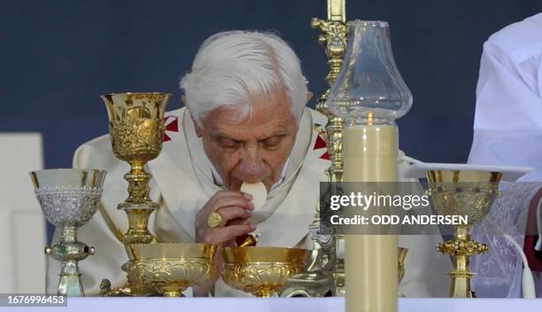 Pope Benedict XVI celebrates the Last Supper during a mass in front of the Cathedral in Erfurt, eastern Germany, on September 24 on the third day of...