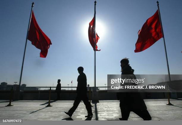 No lowering of Communist Party red flags as people visit rostrum above Tiananmen Gate overlooking Tiananmen Square in central Beijing, 17 January...