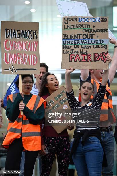 National Health Service workers hold placards at a picket line outside University College Hospital in central London on September 20, 2023 as...