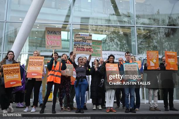 National Health Service workers hold placards at a picket line outside University College Hospital in central London on September 20, 2023 as...