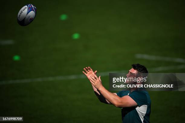 Australia's hooker Matt Faessler catches a ball as he takes part in a Rugby World Cup 2023 training session at Stade Roger Baudras in...