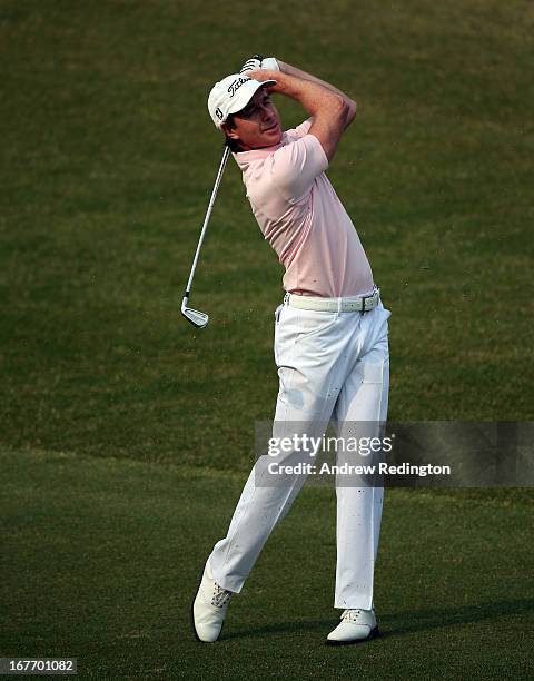 Brett Rumford of Australia plays his approach shot on the first play-off hole to set up and eagle and victory in the Ballantine's Championship at...