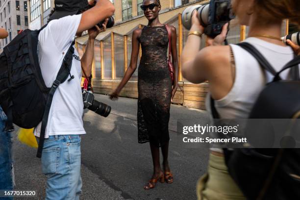 Model walks towards photographers outside of the Whitney Museum of American Art during a fashion show on September 12, 2023 in New York City. New...