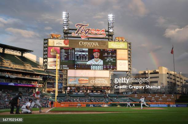 Joey Wentz of the Detroit Tigers throws a second inning pitch against Nick Senzel of the Cincinnati Reds with a rainbow in the background at Comerica...