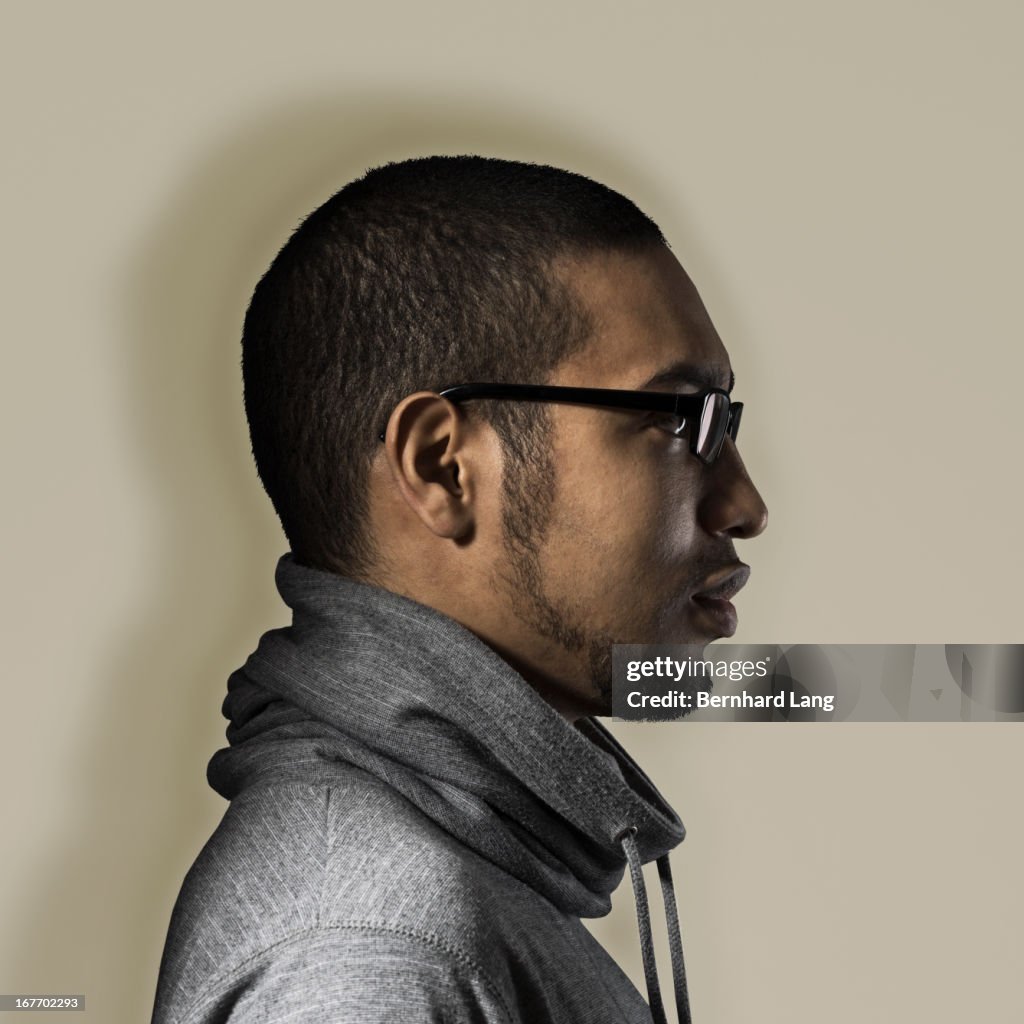 Young man with glasses, close-up, profile