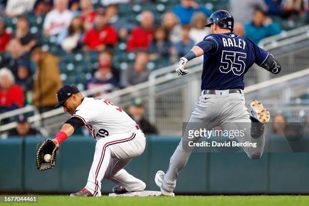 Donovan Solano of the Minnesota Twins fields the ball at first base for a force out against Luke Raley of the Tampa Bay Rays in the second inning at...