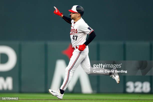 Edouard Julien of the Minnesota Twins celebrates his solo home run as he rounds the bases against the Tampa Bay Rays in the third inning at Target...