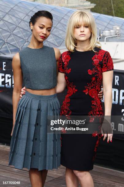 Actresses Zoe Saldana and Alice Eve attend a 'Star Trek Into Darkness' photocall at China Club on April 28, 2013 in Berlin, Germany.