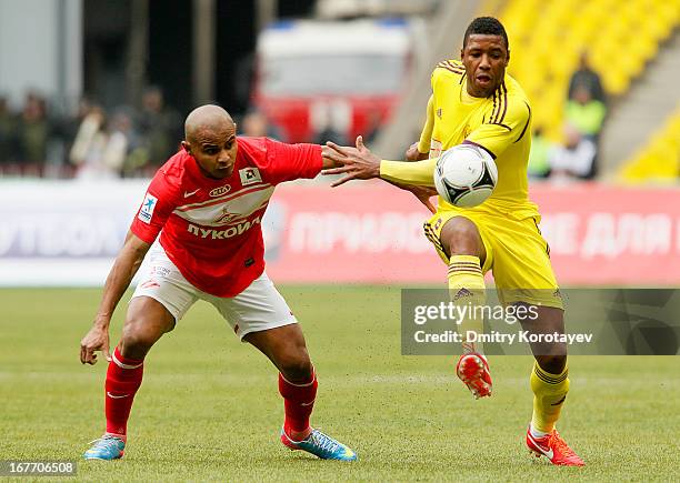 Ari of FC Spartak Moscow competes for the ball with Jucilei of FC Anzhi Makhachkala during the Russian Premier League match between FC Spartak Moscow...