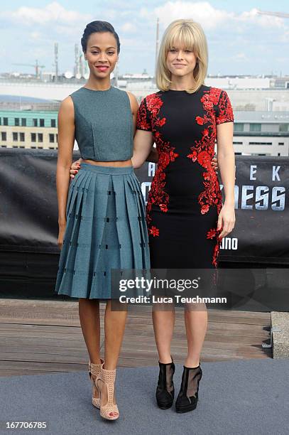 Zoe Saldana and Alice Eve attend the 'Star Trek Into Darkness' Photocall at China Club on April 28, 2013 in Berlin, Germany.