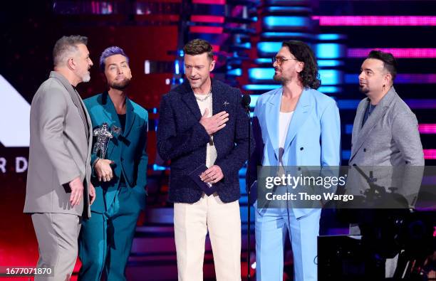 Joey Fatone, Lance Bass, Justin Timberlake, JC Chasez, and Chris Kirkpatrick of *NSYNC speak onstage the 2023 MTV Video Music Awards at Prudential...