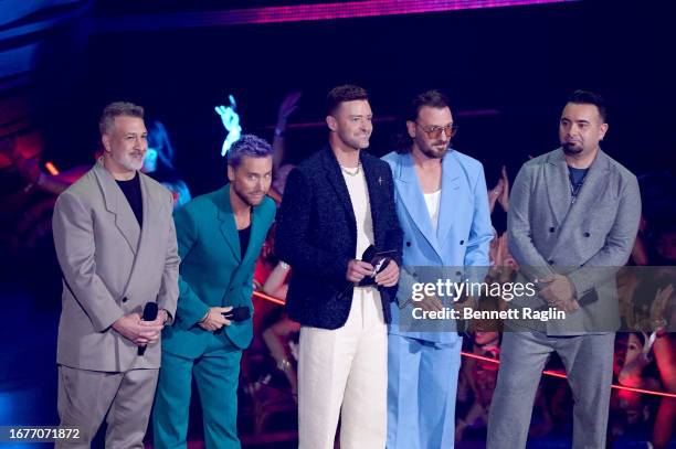 Joey Fatone, Lance Bass, Justin Timberlake, JC Chasez, and Chris Kirkpatrick of *NSYNC speak onstage the 2023 MTV Video Music Awards at Prudential...