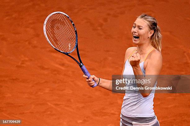 Maria Sharapova of Russia celebrates after defeating Na Li of China in the final match during Day 7 of the Porsche Tennis Grand Prix at Porsche-Arena...