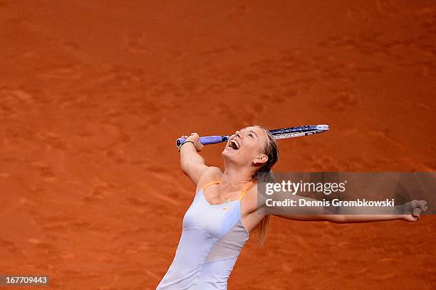 Maria Sharapova of Russia celebrates after defeating Na Li of China in the final match during Day 7 of the Porsche Tennis Grand Prix at Porsche-Arena...