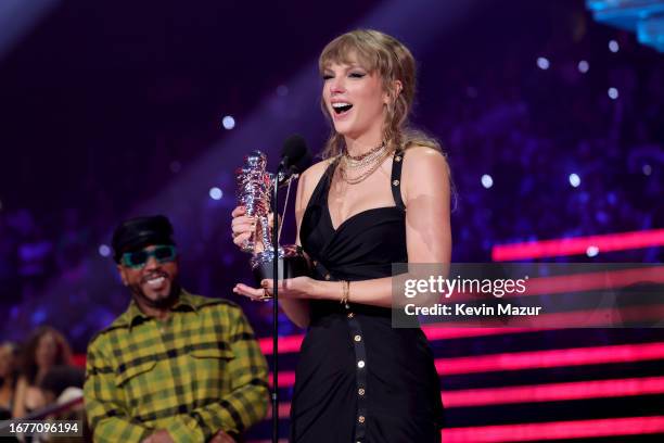 Taylor Swift accepts the Song of the Year award for "Anti-Hero" from Timbaland and Nelly Furtado onstage during the 2023 MTV Video Music Awards at...