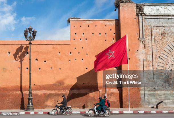 old city wall, marrakesh, morocco - motorbike flag stock pictures, royalty-free photos & images