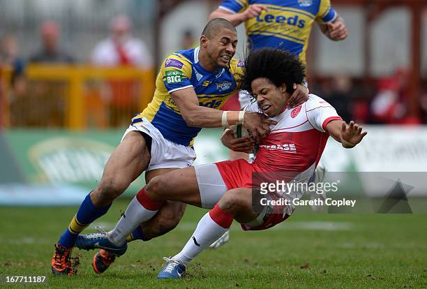 Luke George of Hull KR is tacked by Kallum Watkins of Leeds during the Super League match between Hull Kingston Rovers and Leeds Rhinos at Craven...