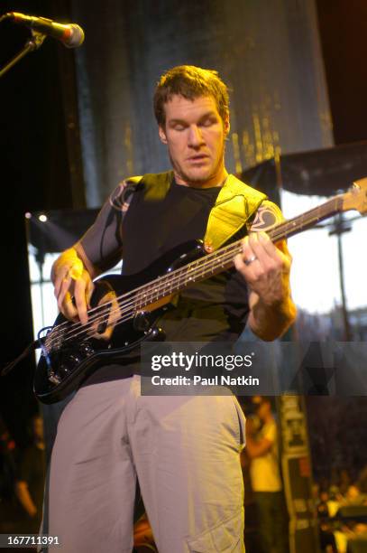 American rock band Audioslave performs on stage, Milwaukee, Wisconsin, July 11, 2003. Pictured is bassist Tim Commerford.