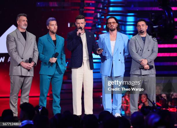 Joey Fatone, Lance Bass, Justin Timberlake, JC Chasez, and Chris Kirkpatrick of *NSYNC speak onstage the 2023 MTV Video Music Awards at Prudential...