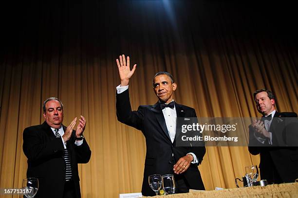 President Barack Obama waves to the audience during the White House Correspondents' Association dinner in Washington, District of Columbia, U.S., on...