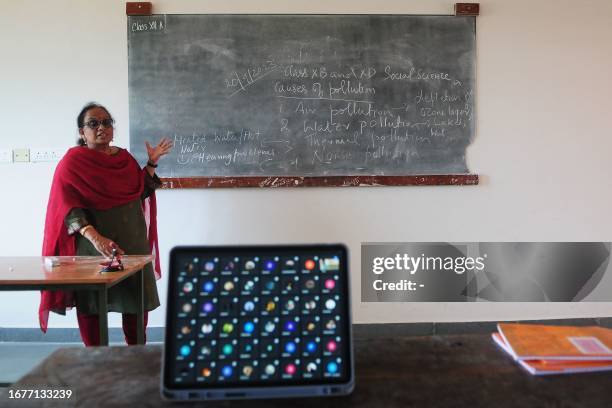 Teacher conducts an online class at a school in Kozhikode on September 20 after local authorities closed all educational institutes in Kerala's...