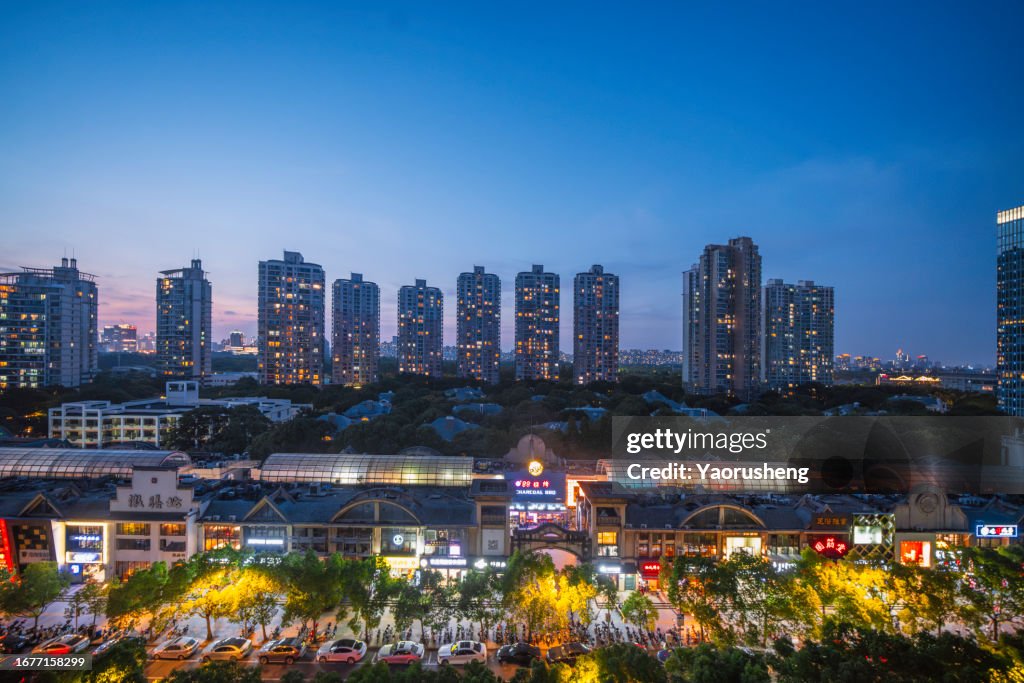 Crowded street and modern residential apartment at twilight,shanghai,china