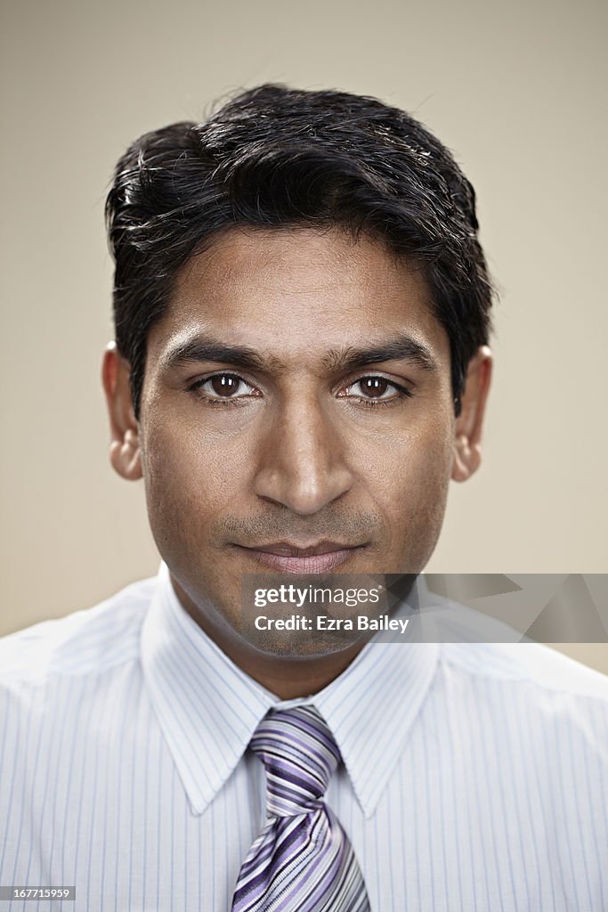 Portrait of a businessman looking into camera.
