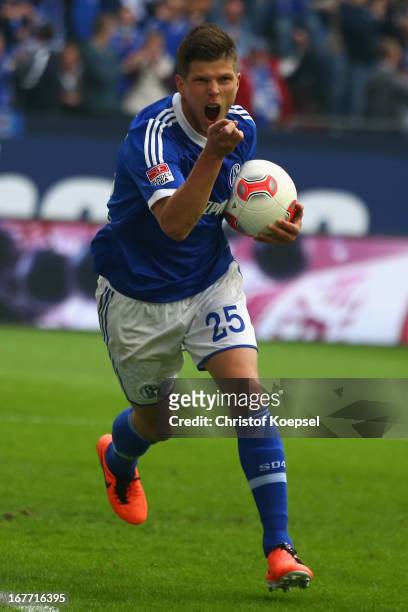 Klaas-Jan Huntelaar of Schalke celebrates the second goal during the Bundesliga match between FC Schalke 04 and Hamburger SV at Veltins-Arena on...