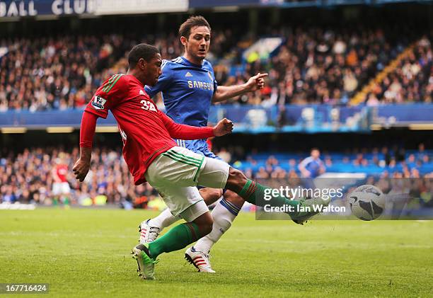 Jonathan de Guzman of Swansea City beats Frank Lampard of Chelsea to the ball during the Barclays Premier League match between Chelsea and Swansea...