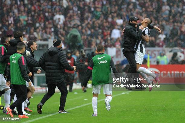 Arturo Vidal of Juventus celebrates with his head coach Antonio Conte after scoring the opening goal during the Serie A match between Torino FC and...
