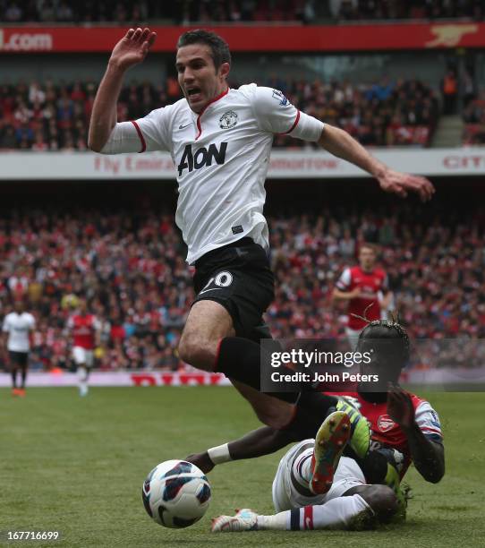 Robin van Persie of Manchester United is fouled by Bacary Sagna of Arsenal and is awarded a penalty during the Barclays Premier League match between...