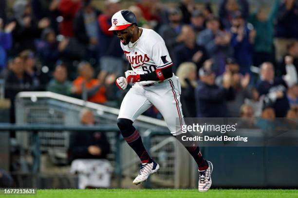 Willi Castro of the Minnesota Twins celebrates his two-run home run as he rounds the bases against the Tampa Bay Rays in the seventh inning at Target...