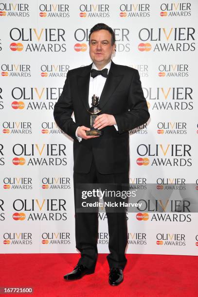 Richard Mccabe poses with his award The Laurence Olivier Awards at The Royal Opera House on April 28, 2013 in London, England.
