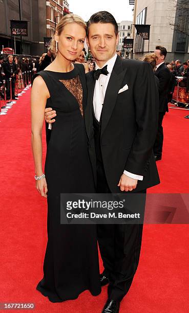 Clare Harding and Tom Chambers arrive at The Laurence Olivier Awards 2013 at The Royal Opera House on April 28, 2013 in London, England.