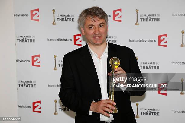 French actor Francois Loriquet poses after receiving the best supporting actor award for his part in "Les revenants" during the "Palmares du Theatre"...
