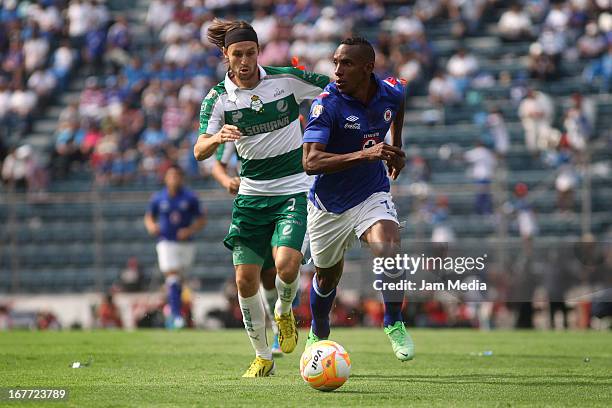 Amaranto Perea of Cruz Azul struggles for the ball with Edgar Gerardo Lugo of Santos during the match between Cruz Azul and Santos as part of the...